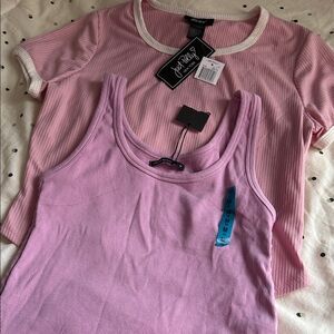 Woman’s tops 2 pink short sleeve/sleeveless tops size medium